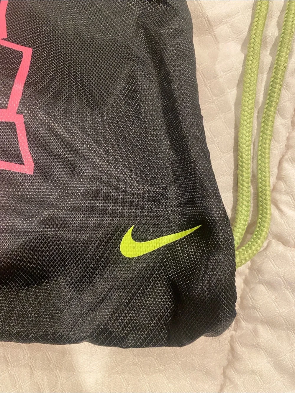 Nike Black Drawstring Backpack with Pink Logo and Lime Green Accents